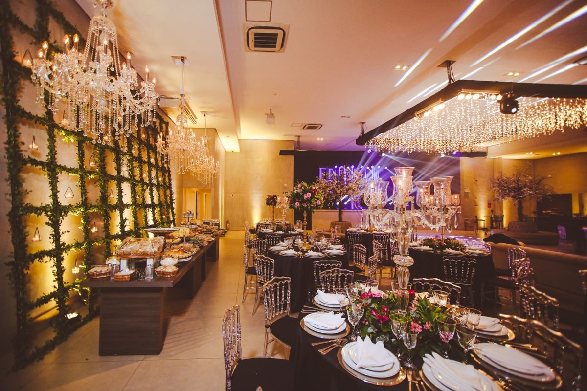 Elegant Banquet Hall with Crystal Chandeliers and Greenery Wall