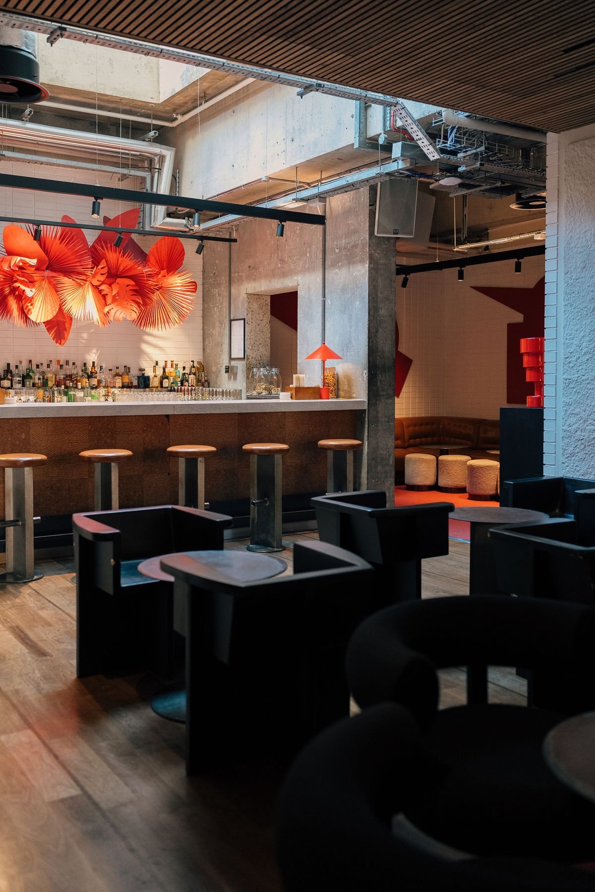 Industrial Bar with Red Sculptural Ceiling Art