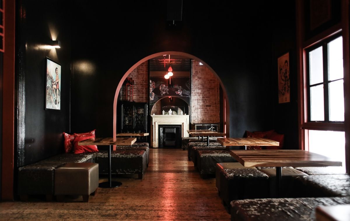 Moody Lounge Bar with Red Arch and Fireplace