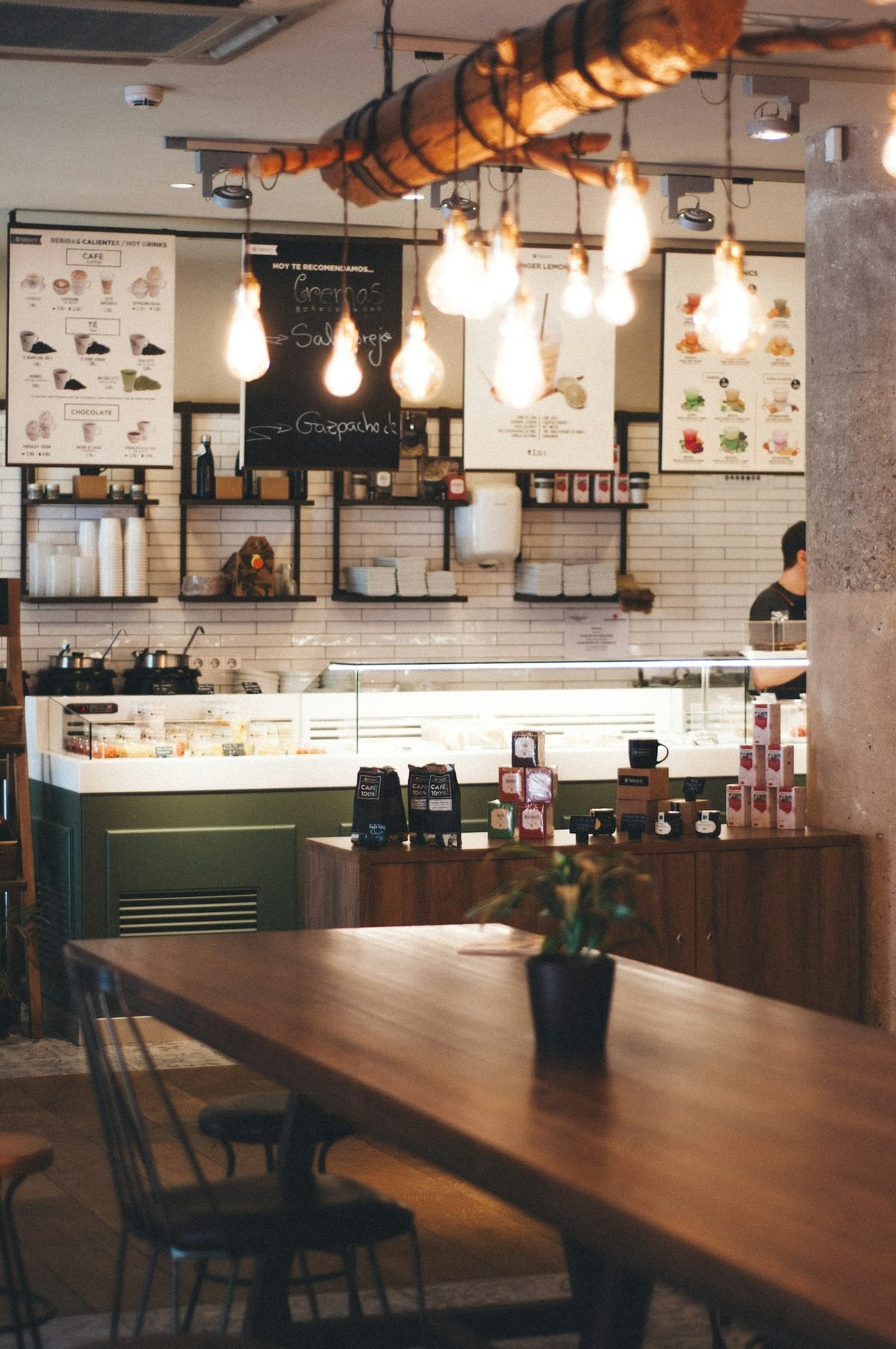 Rustic Caf&eacute; Kitchen with Open Shelving and Hanging Bulbs