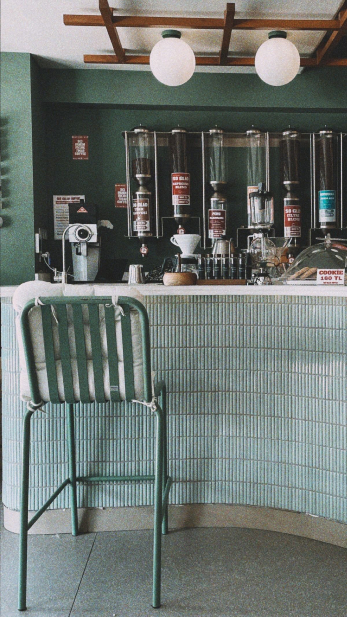 Vintage Book Caf&eacute; with Teal Cabinetry and Brass Pendant