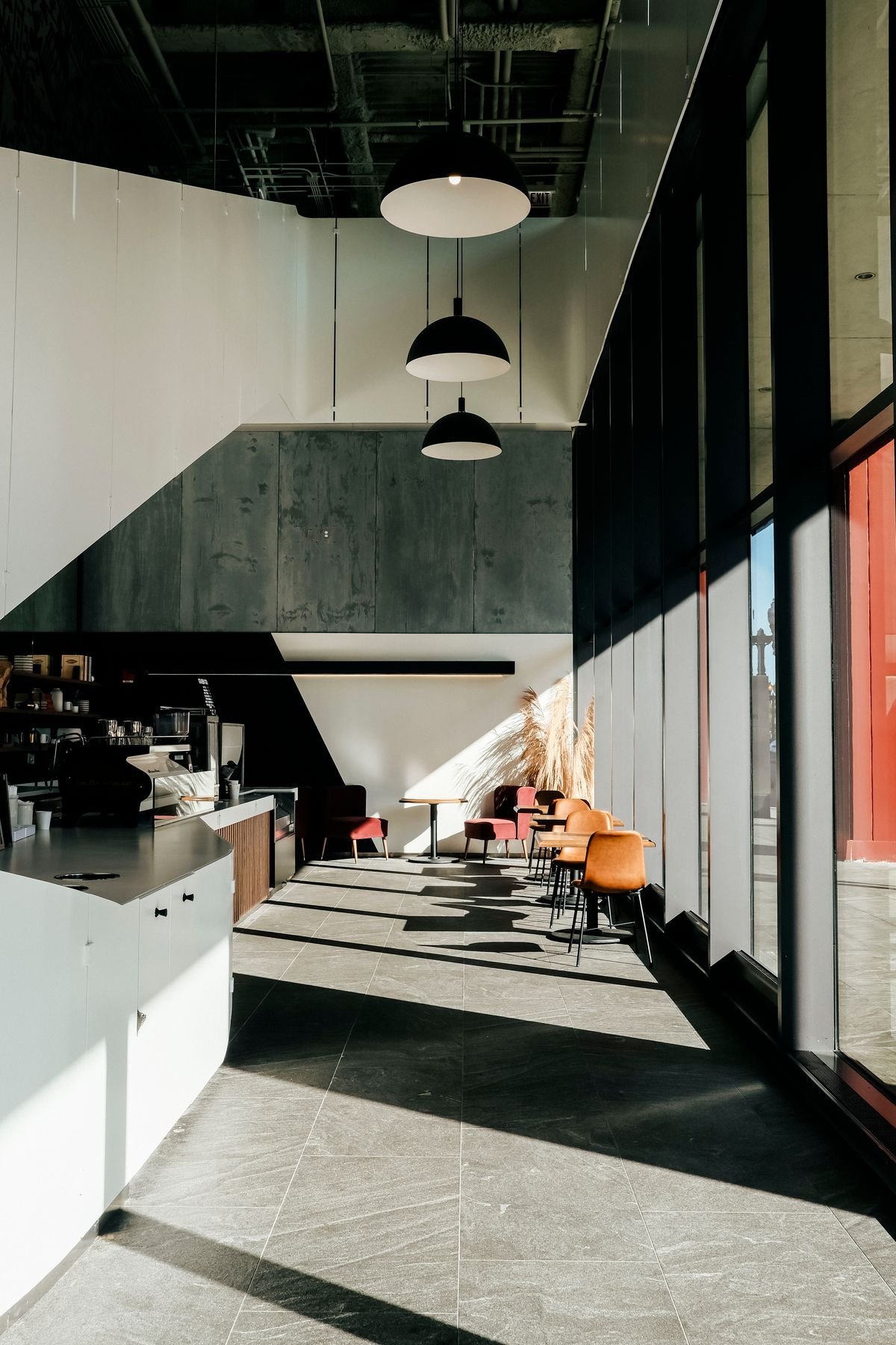 Architectural Caf&eacute; with Angular Ceiling and Sunlit Seating