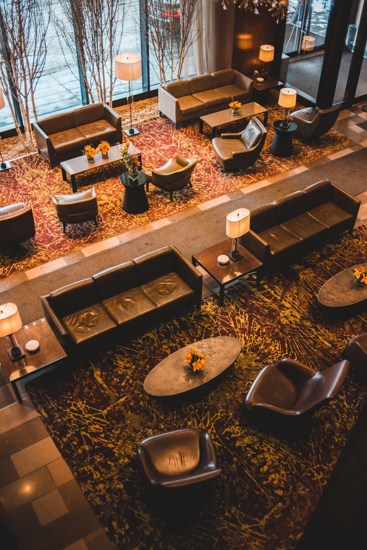 Aerial View of Hotel Lounge with Patterned Rugs and Leather Sofas
