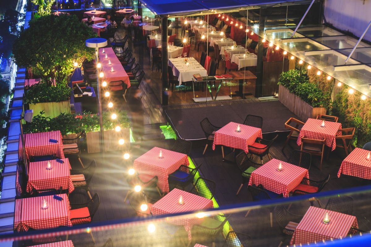 Outdoor string and ambient lighting on a rooftop terrace