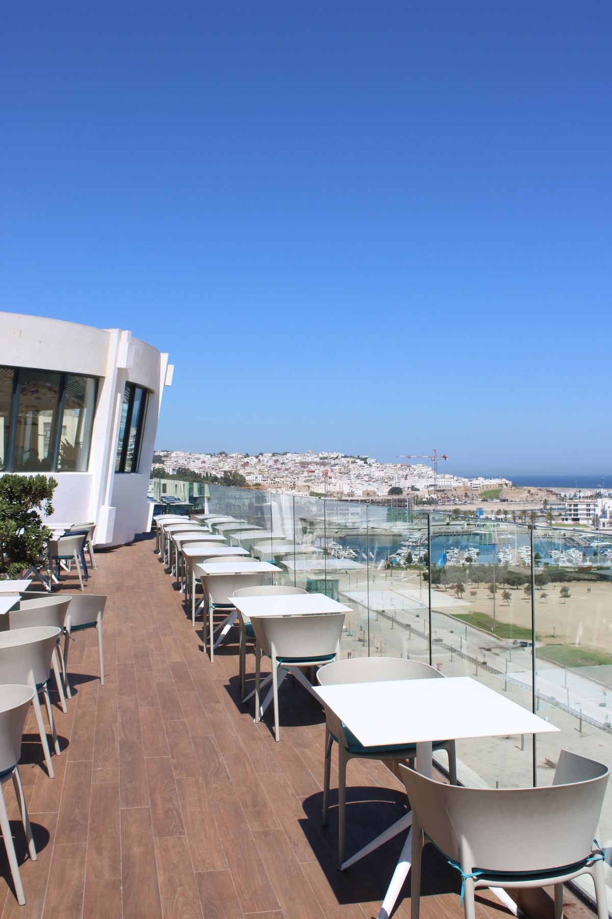 Bright Coastal Rooftop Terrace with Marina and City Views