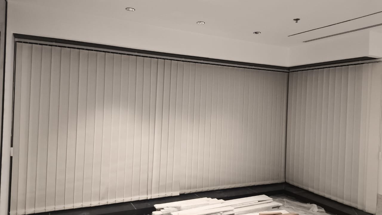 Dark Venetian Blinds with a Night City View