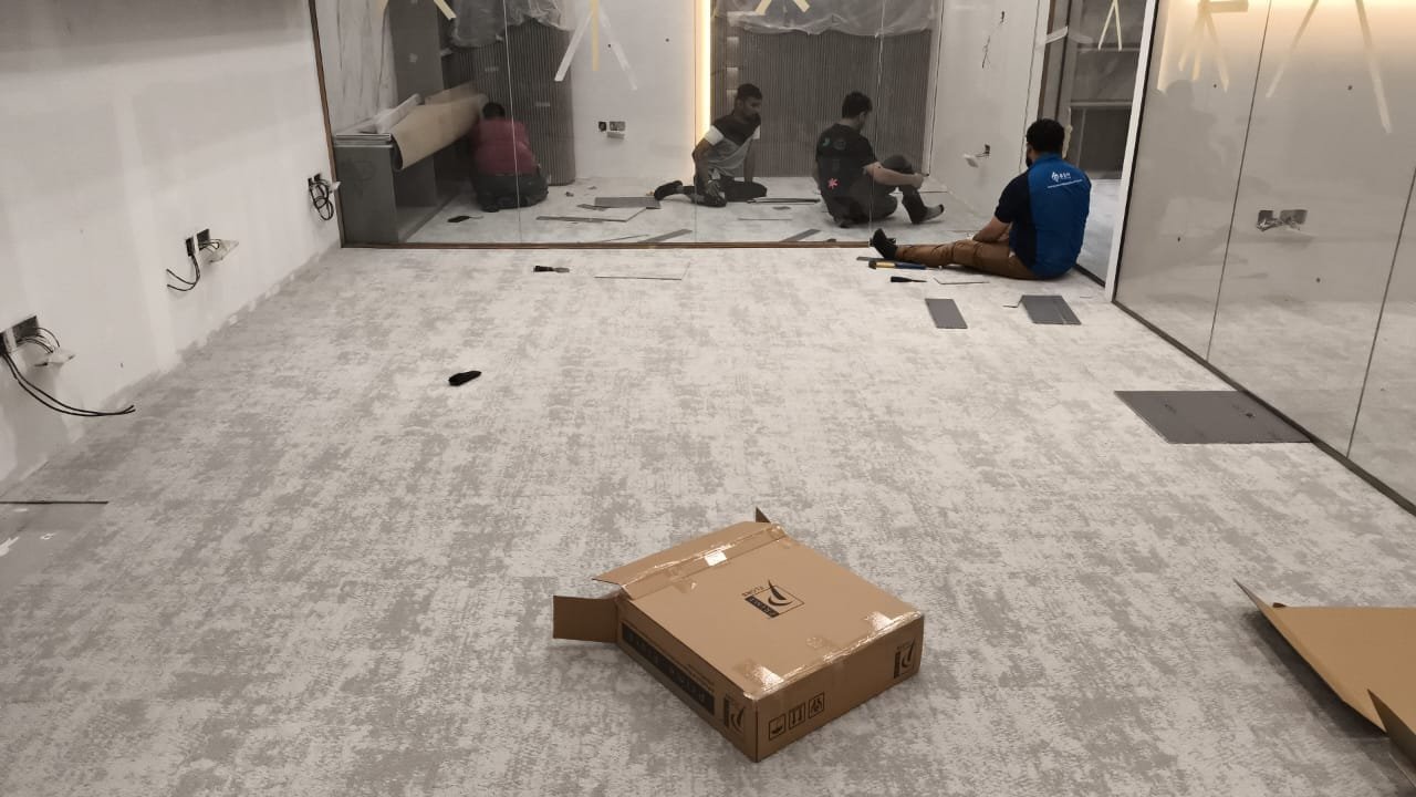Our Team Laying Carpet Tiles On-Site