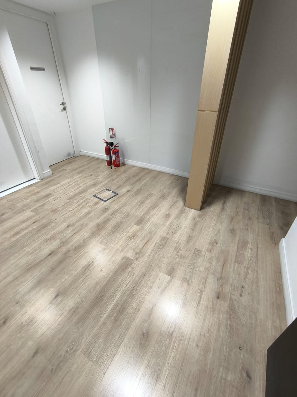 Light Wood-Tone Flooring Finished in a Commercial Space